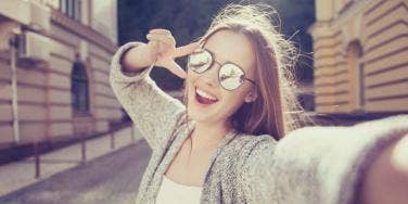 smiling woman tired from adrenal fatigue