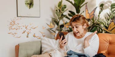 Woman receiving a text and getting butterflies