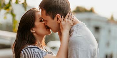 man and woman kissing