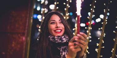 woman holding sparkler