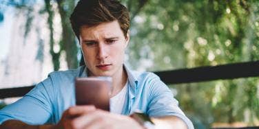 man looking at phone