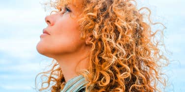 woman looking up at sky