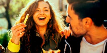 couple eating and laughing together