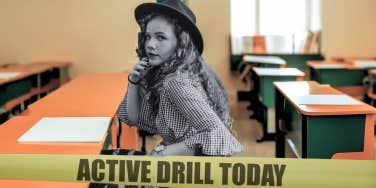 Teenager sitting in school classroom