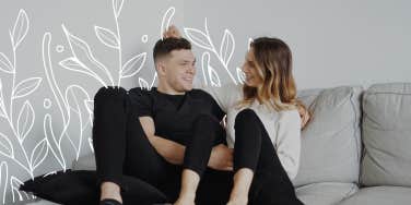 Happy couple sitting on couch