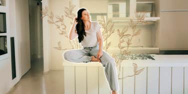 Woman sitting on her counter 