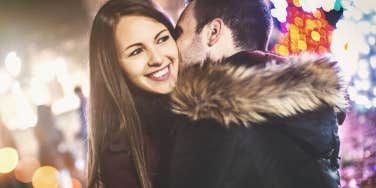 Man kissing woman on cheek 