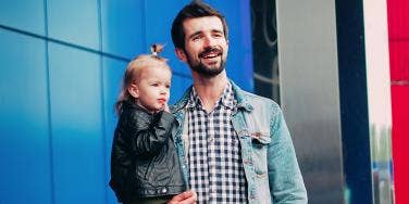 husband holding baby