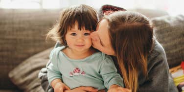 mom kissing toddler