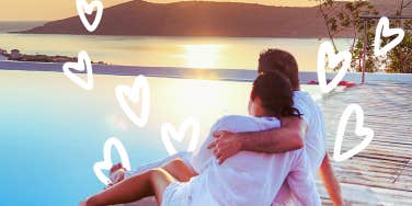 Couple surrounded by hearts on a dock