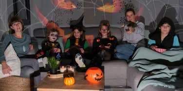 Family watching tv on Halloween