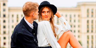 couple sitting together in big city
