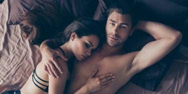 man and woman in bed