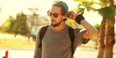 man in sunglasses with backpack on