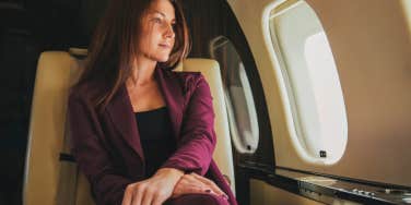 woman sitting on airplane first class