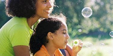 single mom and daughter with bubbles