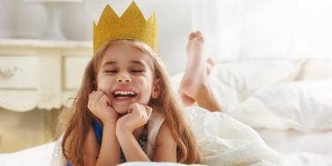 toddler girl with crown on head