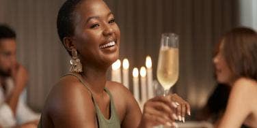 woman cheers wine glass
