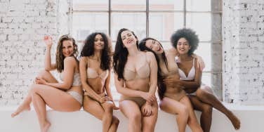 women of different races and body types sitting together