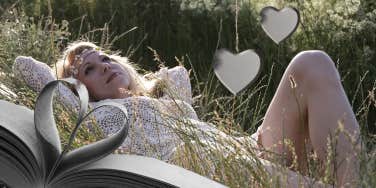 Woman daydreaming laying on the grass