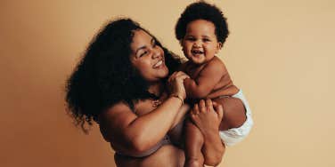 plus size mom holding baby