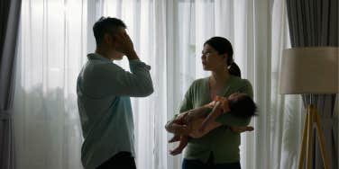 couple with baby arguing