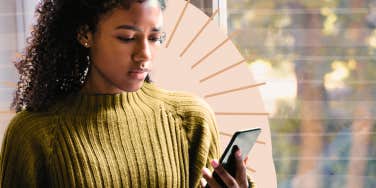 Woman staring at her phone after a seemingly good date