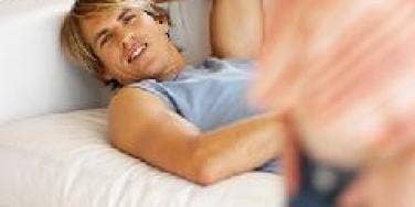 man daydreaming on couch