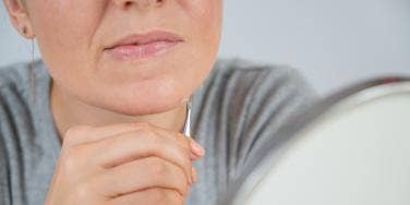 woman plucking chin hair