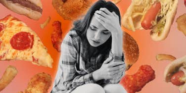 Woman with anxiety surrounded by bad foods 