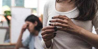 woman touching her wedding band