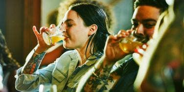 woman drinking a cocktail