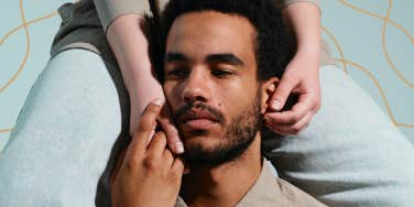 Man possessively holding woman close