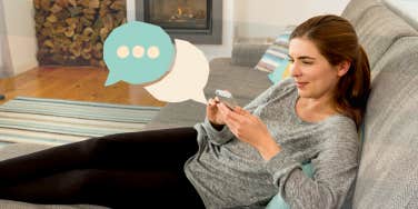 Woman texting on the couch