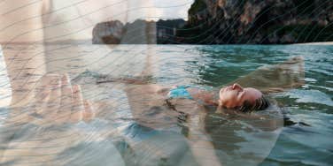 Woman floating and mediatating after a long day, to calm herself