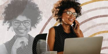 Woman happily working on her laptop