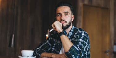 man sitting at cafe