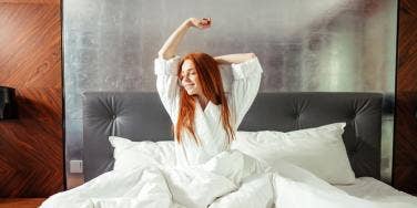 woman happy in bed