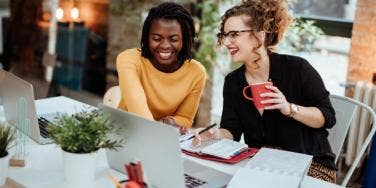 two women working together