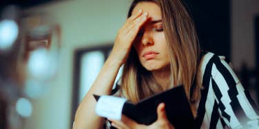 unhappy woman seeing restaurant bill