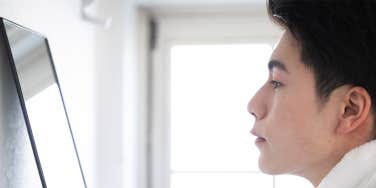 man looking in the mirror