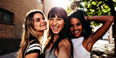 three women posing for a selfie
