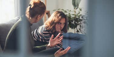 Teenage girl in difficult mood with angry mom.