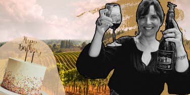 Author celebrating with a glass of wine