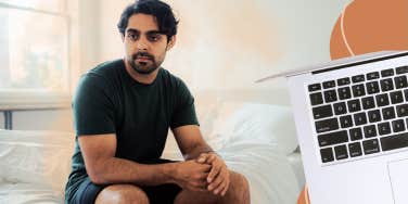 Man sitting on edge of bed, confused