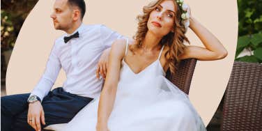 enthralled bride sitting by new husband in her wedding dress