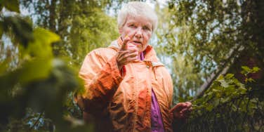 Elderly woman outside in nature
