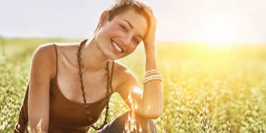 woman smiling in a field