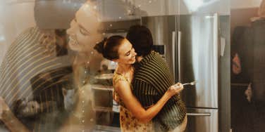 Couple dancing in their kitchen