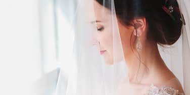 bride standing near window